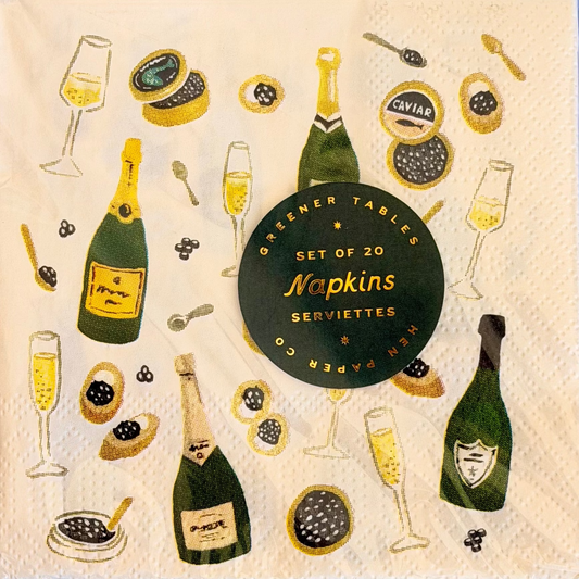 Decorative paper napkins with champagne bottles, glasses, and caviar illustration on a beige background.